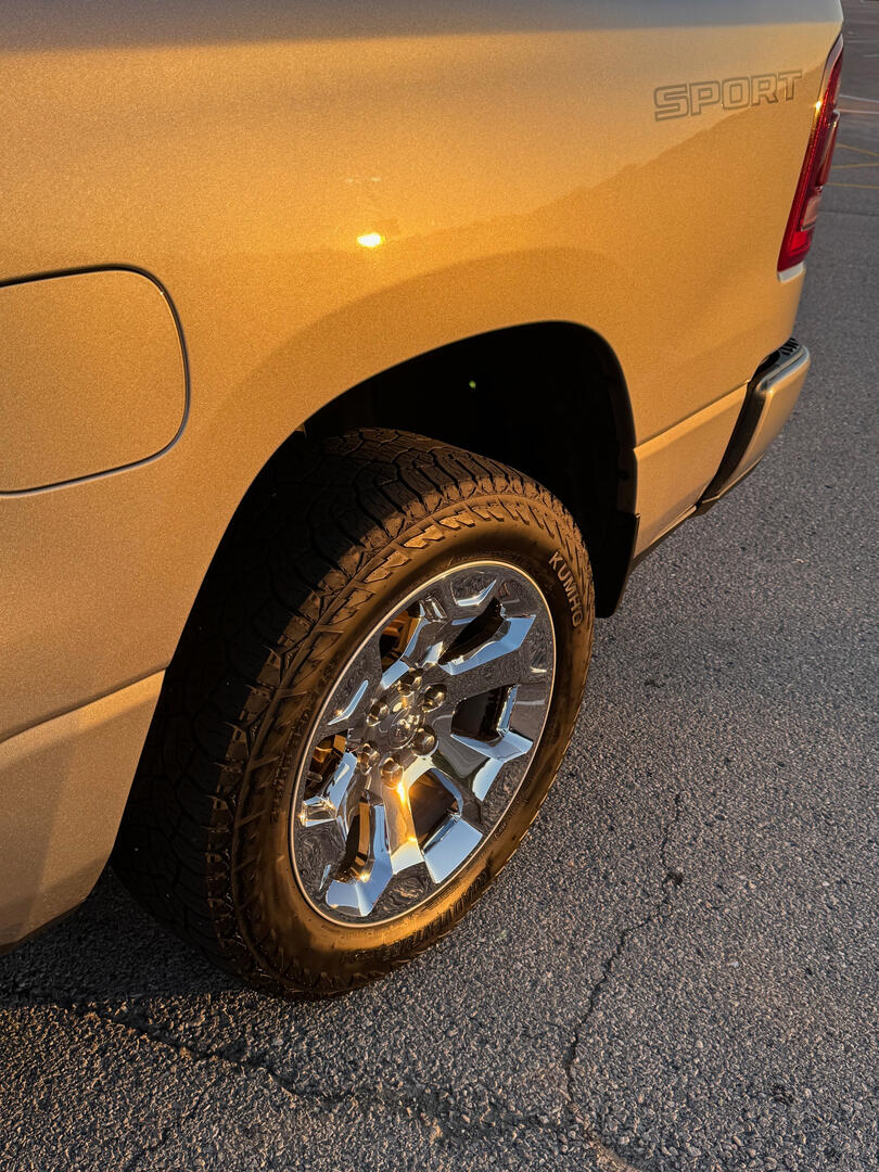 Finished silver Ram truck rear wheel and body after detailing
