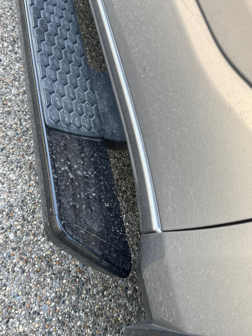 Dirty truck running board before detailing
